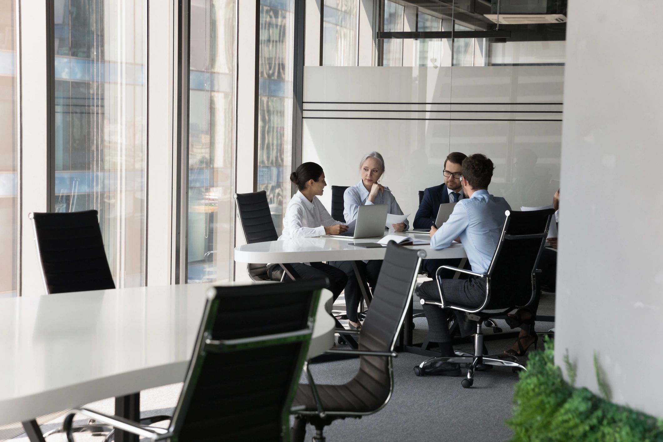 Consulting team collaborating around a project table