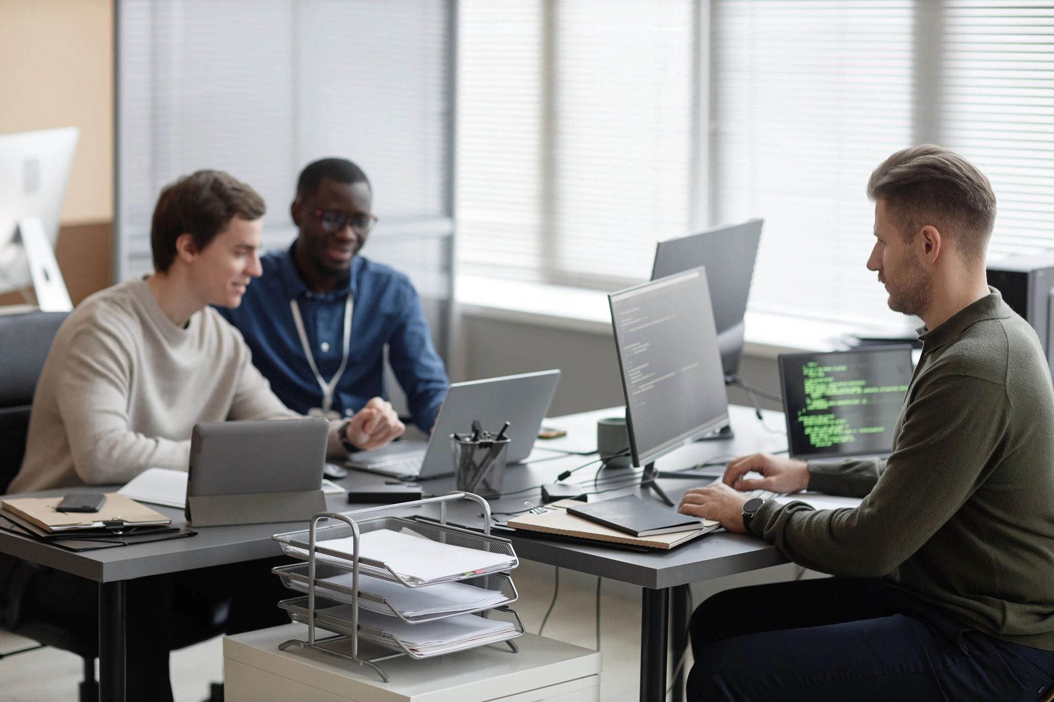 Operations team reviewing dashboards in a modern office