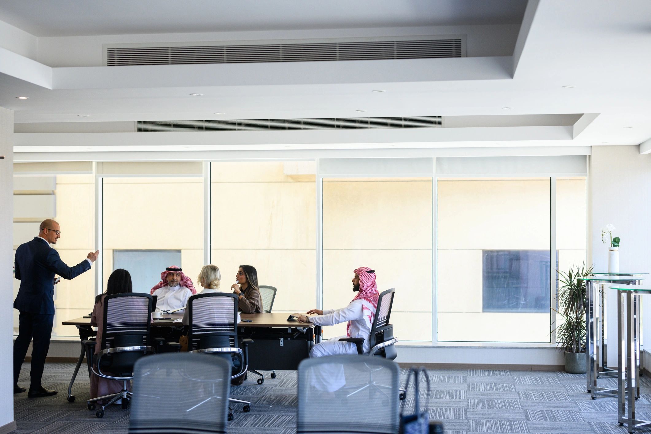Global professionals in a boardroom meeting