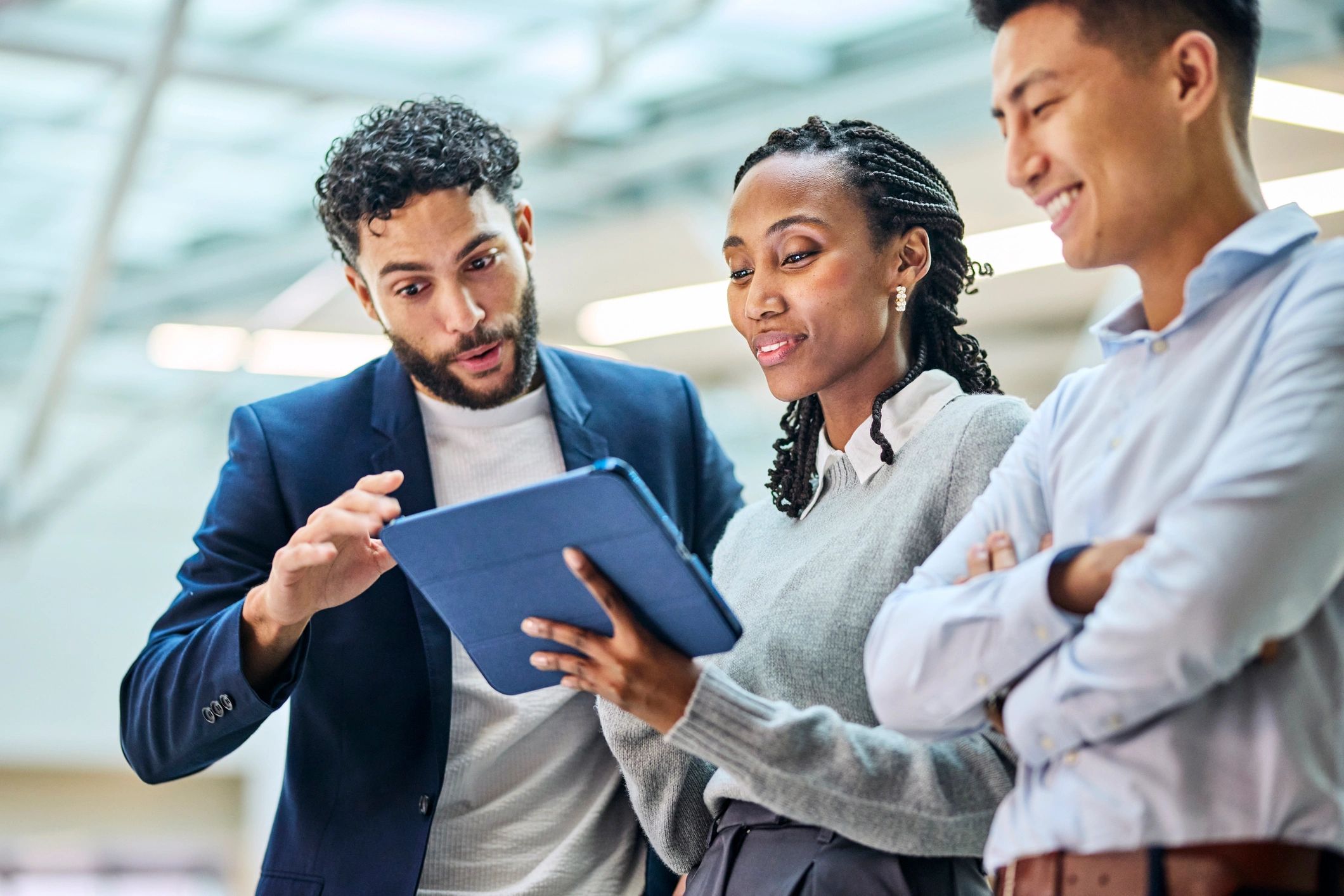 Business colleagues reviewing data on a tablet
